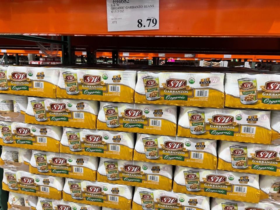 stacked cases of chickpea cans at costco