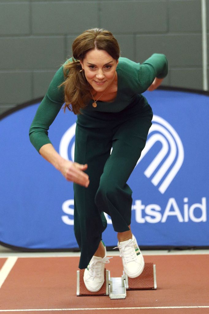 Kate tries out the running track with starting blocks during a SportsAid event at the London Stadium in east London on February 26, 2020 